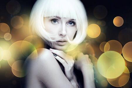 Closeup beauty portrait of stylish young girl with white short hair. Girl looking at camera....
