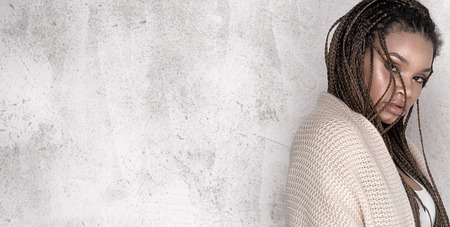 Young beautiful african american girl. Female model posing in studio.の写真素材