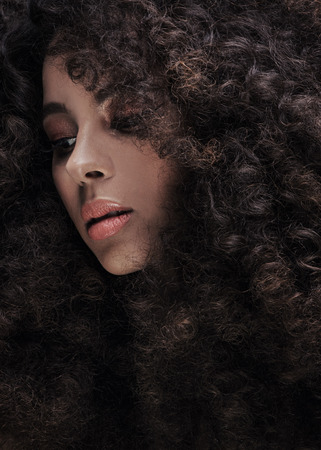Beauty portrait of attractive african american woman with big afro and glamour makeup.の写真素材