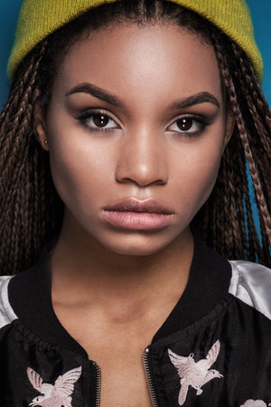 Portrait of young beautiful african american teenager girl with long braids hairstyle.
