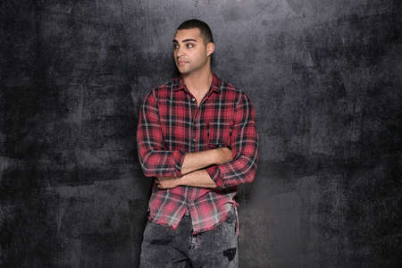 Photo of young handsome african american man in checkered shirt.の写真素材