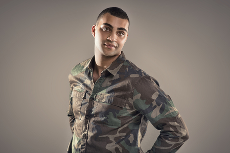 Portrait of handsome african american man looking at camera, studio shot.の写真素材