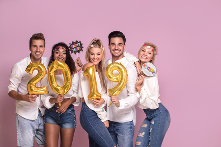 Group of beautiful young people celebrating new year 2019.の写真素材