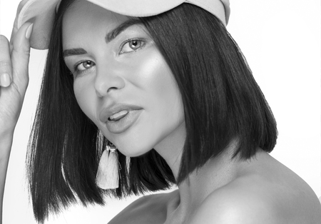 Beautiful girl wearing french style hat, posing on a white background.の写真素材