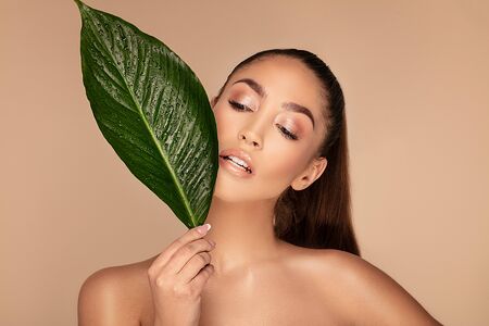 Beauty face of young beautiful woman with a fresh healthy skin. Skin care concept. Beauty treatment. A lot of copy space.の写真素材