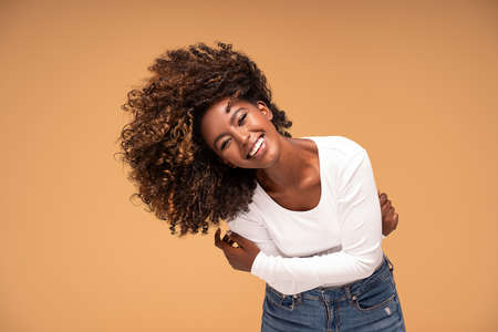 Happy african american woman smiling. Beauty female portrait. Young emotional afro woman. The human emotions, facial expression concept.の写真素材