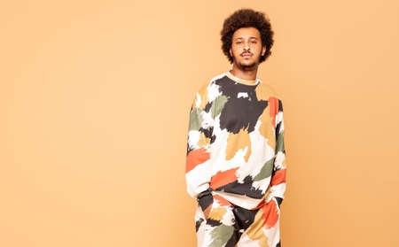 Studio shot of handsome African man wearing fashionable clothes.