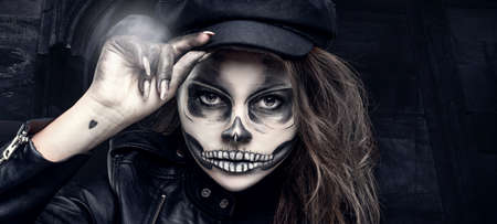Portrait of a woman with skull makeup .Halloween make-up.の写真素材
