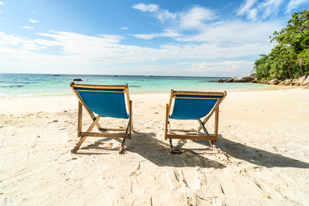 Empty tropical beach landscape. Travel vacations destination. Sunbeds on the sand. tourism. Nature.の写真素材