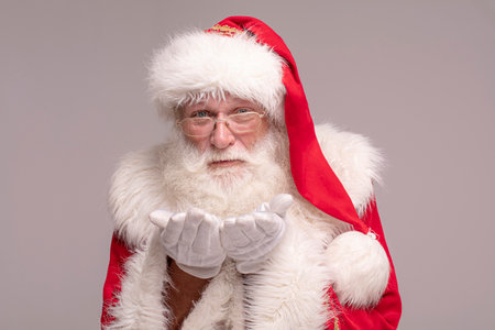 Portrait of real Santa Claus with white beard and red hat.の写真素材