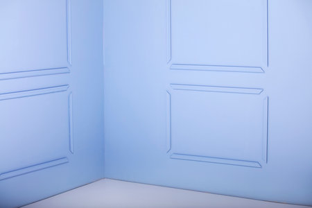 Beautiful ornate on blue wall in studio. Interesting background.の写真素材