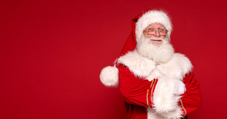 Christmas are coming! Real Santa Claus smiling, posing in studio.の写真素材
