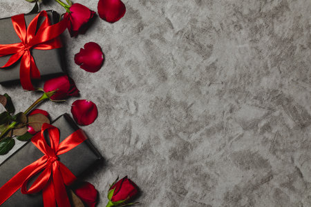 Valentine's day background with red roses and gift boxes. Top view with copy spaceの写真素材