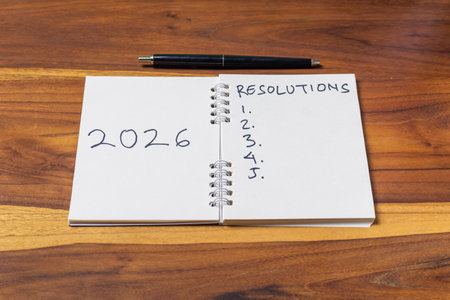 2022 goals list with notebook and pen on wooden table. Happy new year conceptの写真素材