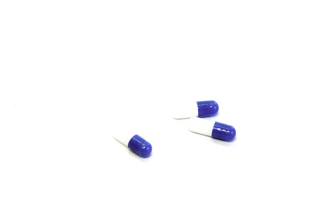 Pills in capsules at white blank  の写真素材