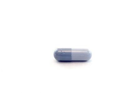 Pills in capsules at white blank  の写真素材