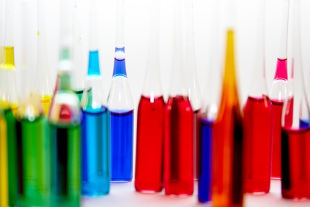 Colored ampuls at white blank  の写真素材