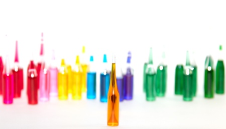 Colored ampuls at white blank  の写真素材