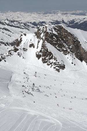 Snow slopes and lifts an mountains for ski and snowboardの写真素材