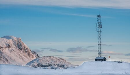 Communication mast in the mountains at the winterの写真素材