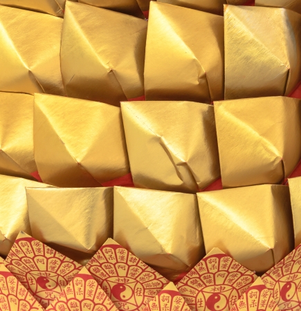 Chinese golden paper in merit ceremony for the dead relatives の写真素材