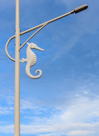 White sea horse street lamp in blue sky backgroundの写真素材