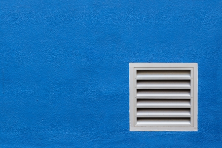 White Vent on Blue Concrete Wallの写真素材
