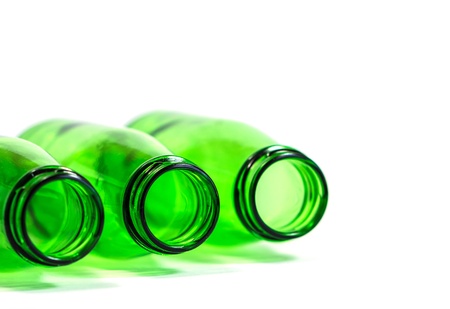 Three Green Bottles Lay Down on White Background with focus on center bottle, Copy Space Above の写真素材