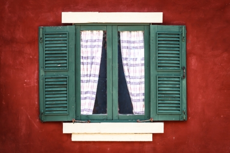 Old Green Window with Curtain on Red Wall, Vignetteの写真素材