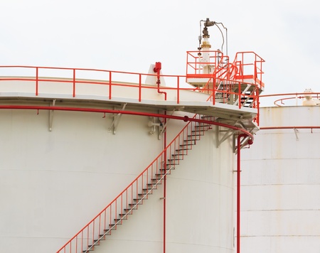 Oil Tank with Vivid Color Pipe and Staircase on White Backgroundの写真素材
