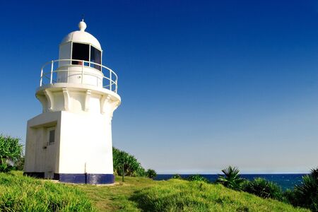 Lighthouse on a bright day with clear skiesの写真素材