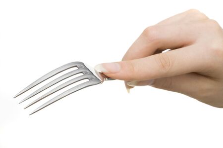 Hand holding fork on whiteの写真素材
