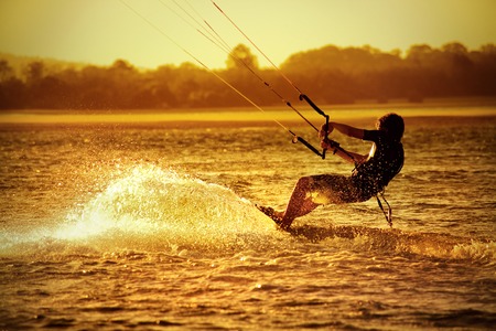Kite boarder on ocean at sunset - sportの写真素材