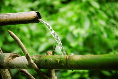 Bamboo lengths of pipe set up to direct waterの写真素材