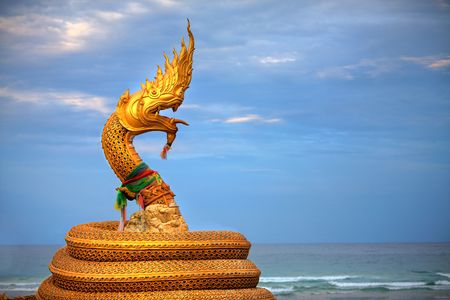 Large statue of golden snake / dragon creatureの写真素材