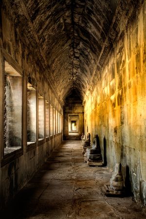 Ancient corridor inside ruins of temple in Cambodiaの写真素材