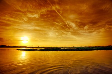 Golden sunset over lake in Phnom Penh (Cambodia)の写真素材