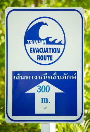 Tsunami evacuation route sign (white and blue)の写真素材