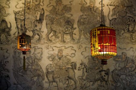 Two Chinese lanterns on asian wallpaper backgroundの写真素材