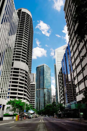 Street level shot of city buildings and streetの写真素材