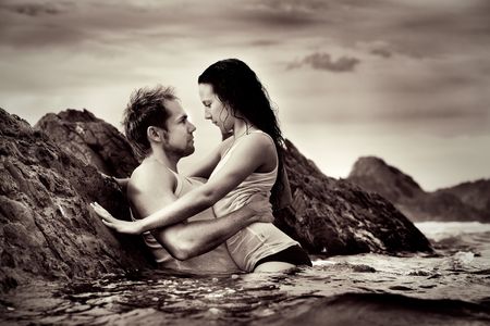 Young sexy couple at beach in underwearの写真素材