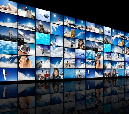 Wall of tv screens showing winter, snow and ice themed imagesの写真素材