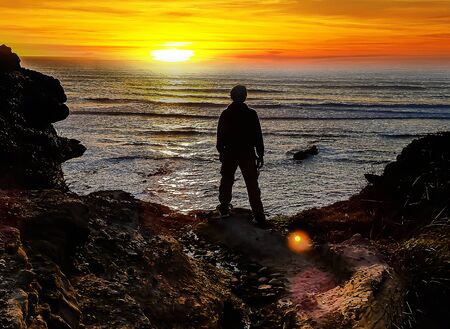 Silhouette of a man admiring the sunset