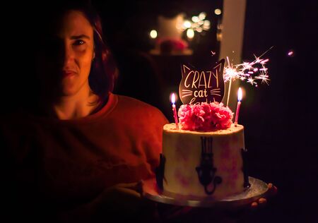 A woman on birthday with birthday cakeの写真素材