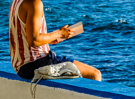 Portrait of a blue-eyed man looking sideways at the lightの写真素材
