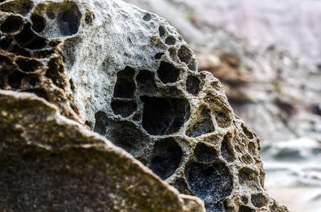 A rock eroded by the wind at the edge of the Atlantic Oceanの写真素材