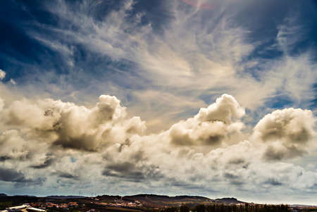 I ask for dramatic clouds in the field in the area where I live