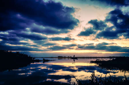 Morning landscape with boats on the canal at the entrance to the oceanの写真素材