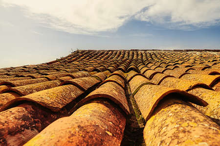 Tiles on the roof of an old house seen in perspectiveの写真素材