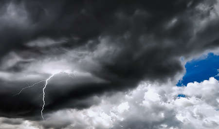 Sky with black storm clouds with lightning